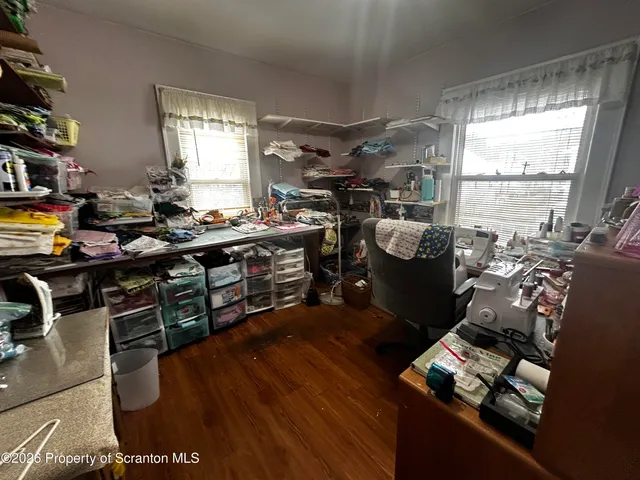 a bedroom that has a bed and a table in it