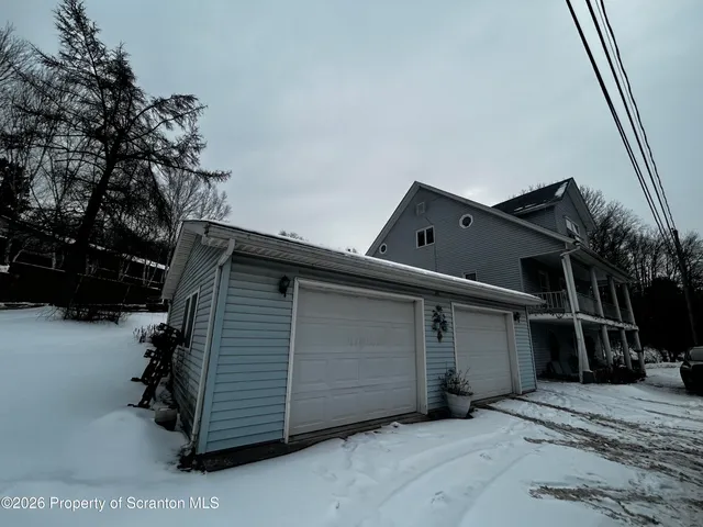 a kitchen with stainless steel appliances granite countertop a refrigerator a sink dishwasher a stove and a refrigerator