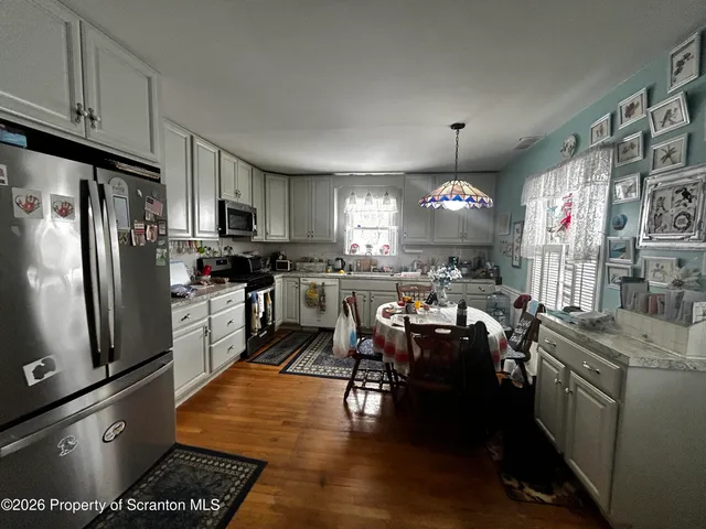 a living room with furniture gym equipment and a window