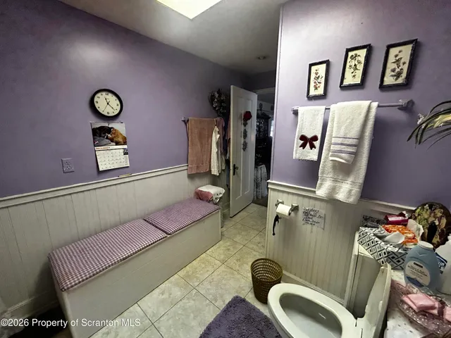 a kitchen with stainless steel appliances kitchen island granite countertop a refrigerator and a sink