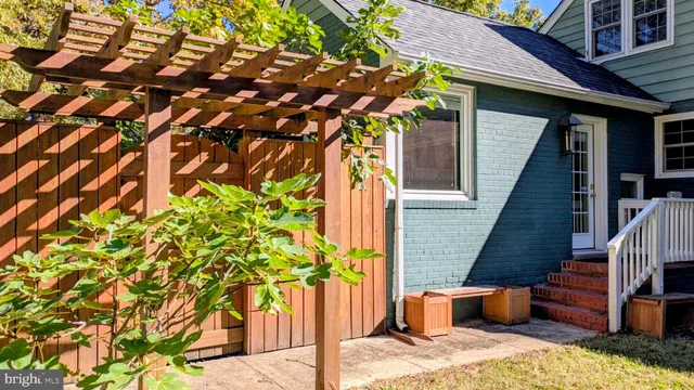 a pathway of a house with a yard