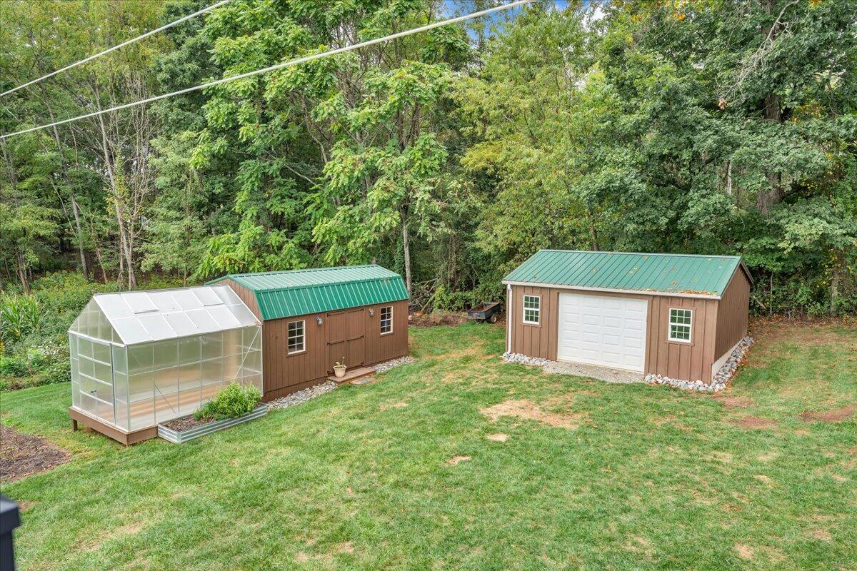 2405 Edwardsville Road Hardy, VA 24101 - Photo 18 of 68 a backyard of a house with a yard and seating area