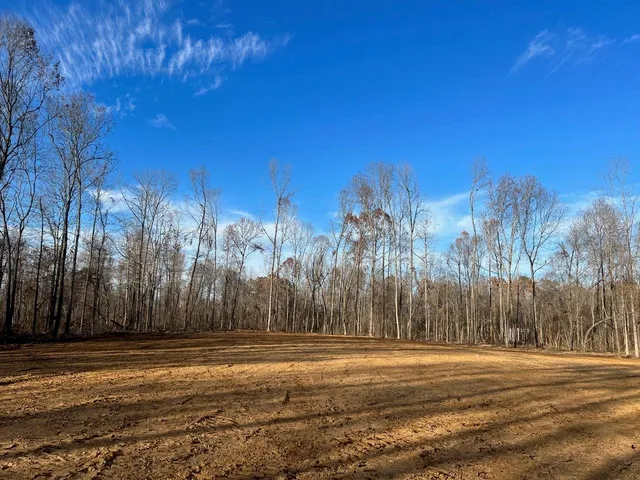 a view of a building with a yard