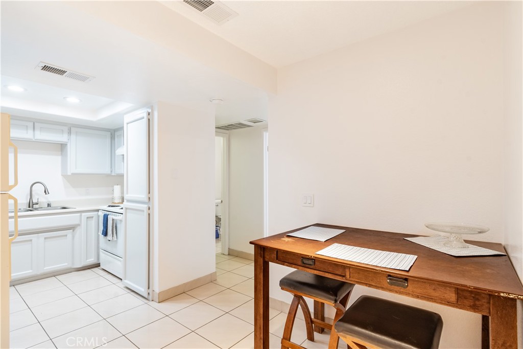 3121 Spring Street, Unit 106 Paso Robles, CA 93446 - Photo 5 of 10 a kitchen with a stove and a refrigerator