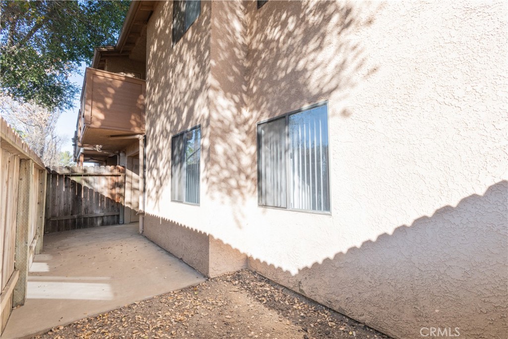 3121 Spring Street, Unit 106 Paso Robles, CA 93446 - Photo 10 of 10 a view of a house with a large tree