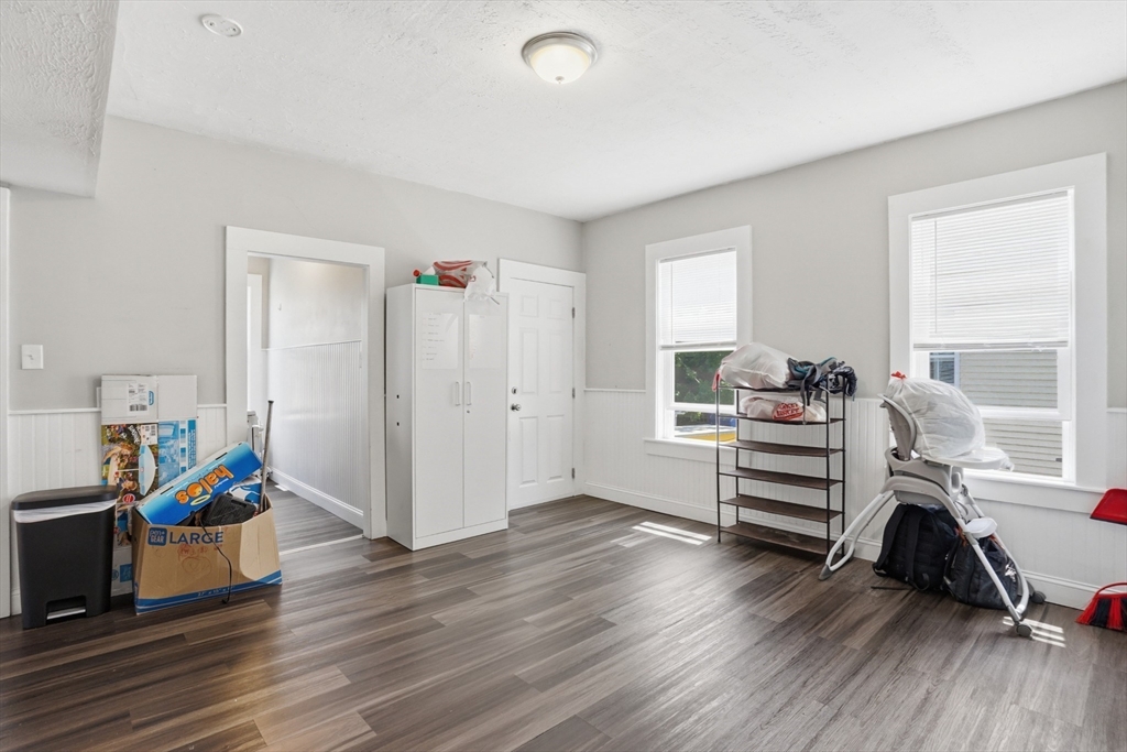 196 Irving Street Fall River, MA 02723 - Photo 4 of 34 a view of a workspace with furniture and wooden floor