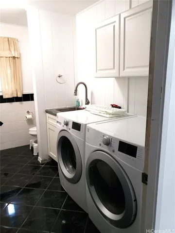 a utility room with dryer and washer