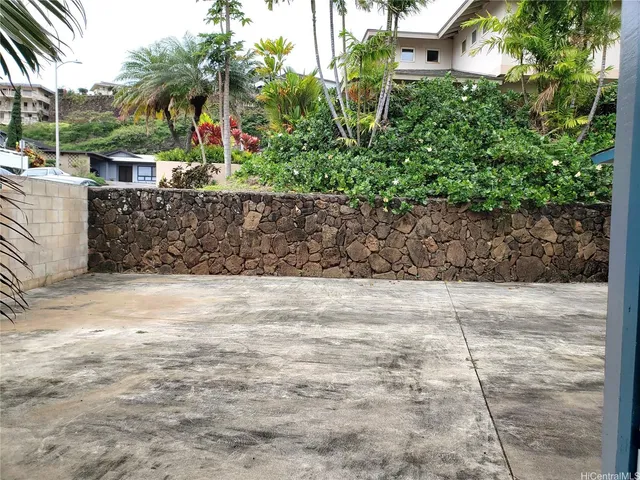 a view of a backyard of a house