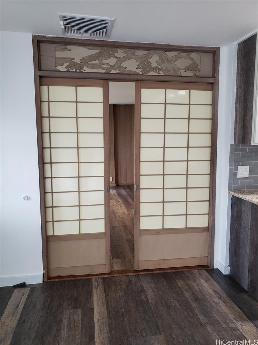 3403 Ala Ilima Street Honolulu, HI 96818 - Photo 8 of 23 an empty room with wooden floor and windows