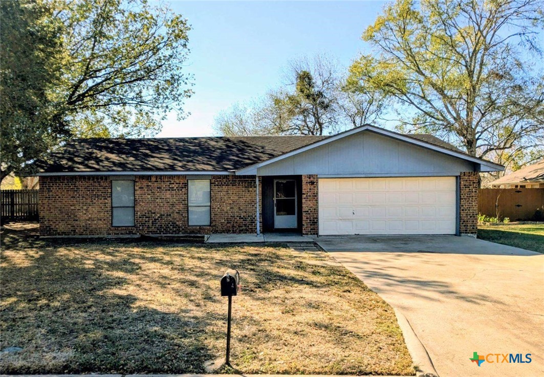 705 3rd Street Cuero, TX 77954 - Photo 1 of 1 a front view of a house with yard