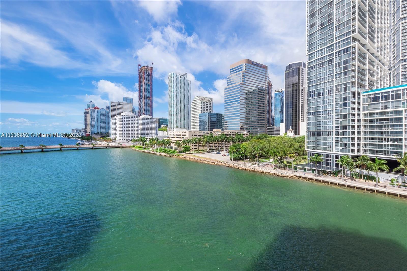 520 Brickell Key Drive, Unit A1102 Miami, FL 33131 - Photo 6 of 20 a view of a city with tall buildings and a big yard