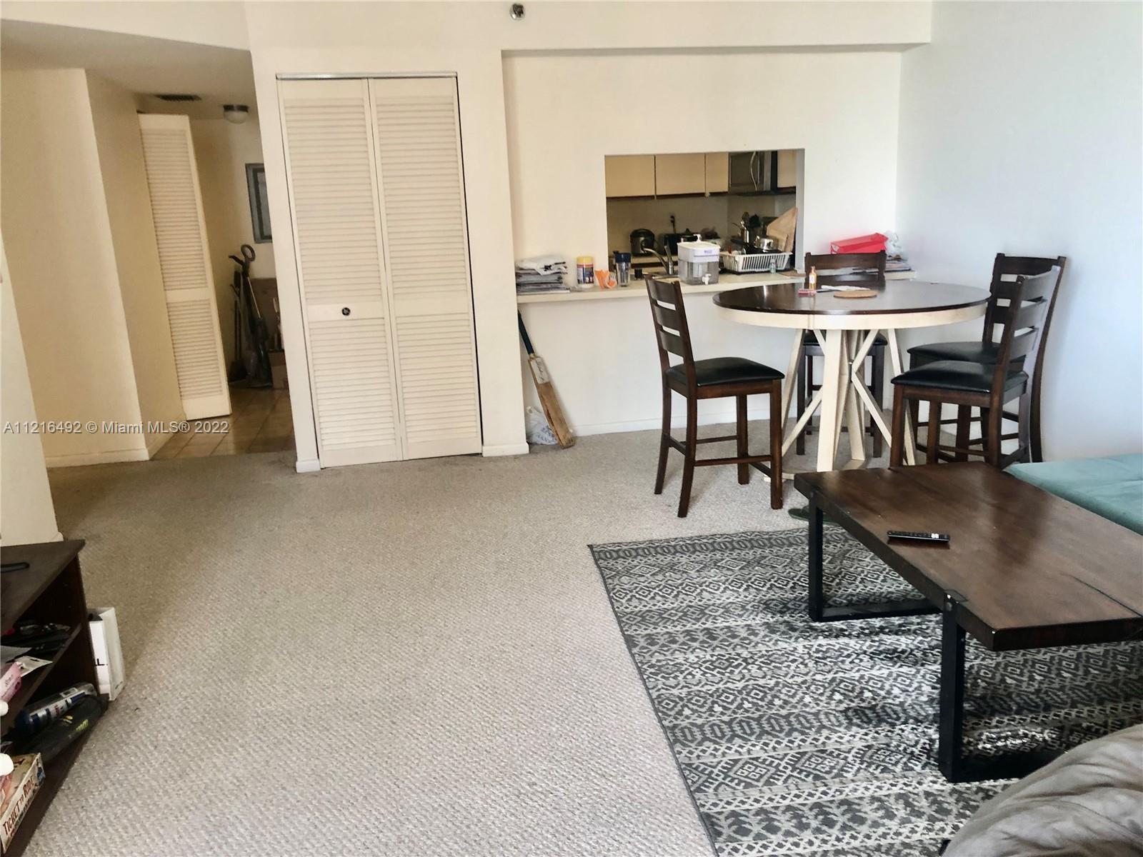 520 Brickell Key Drive, Unit A1102 Miami, FL 33131 - Photo 10 of 20 a view of a dining room with furniture