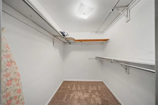 a room with a bed and a window