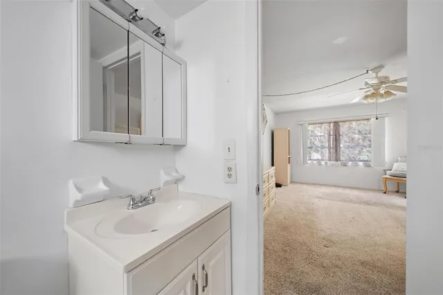 a room with closet and a chandelier fan