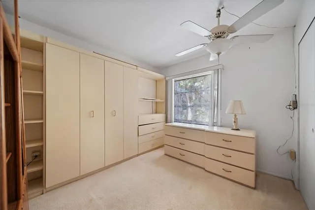 a room with walk in closet and window