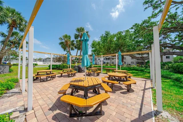 a view of yard with swimming pool outdoor seating and city view