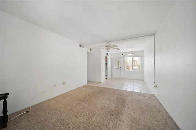 a kitchen with a stove a refrigerator and cabinets