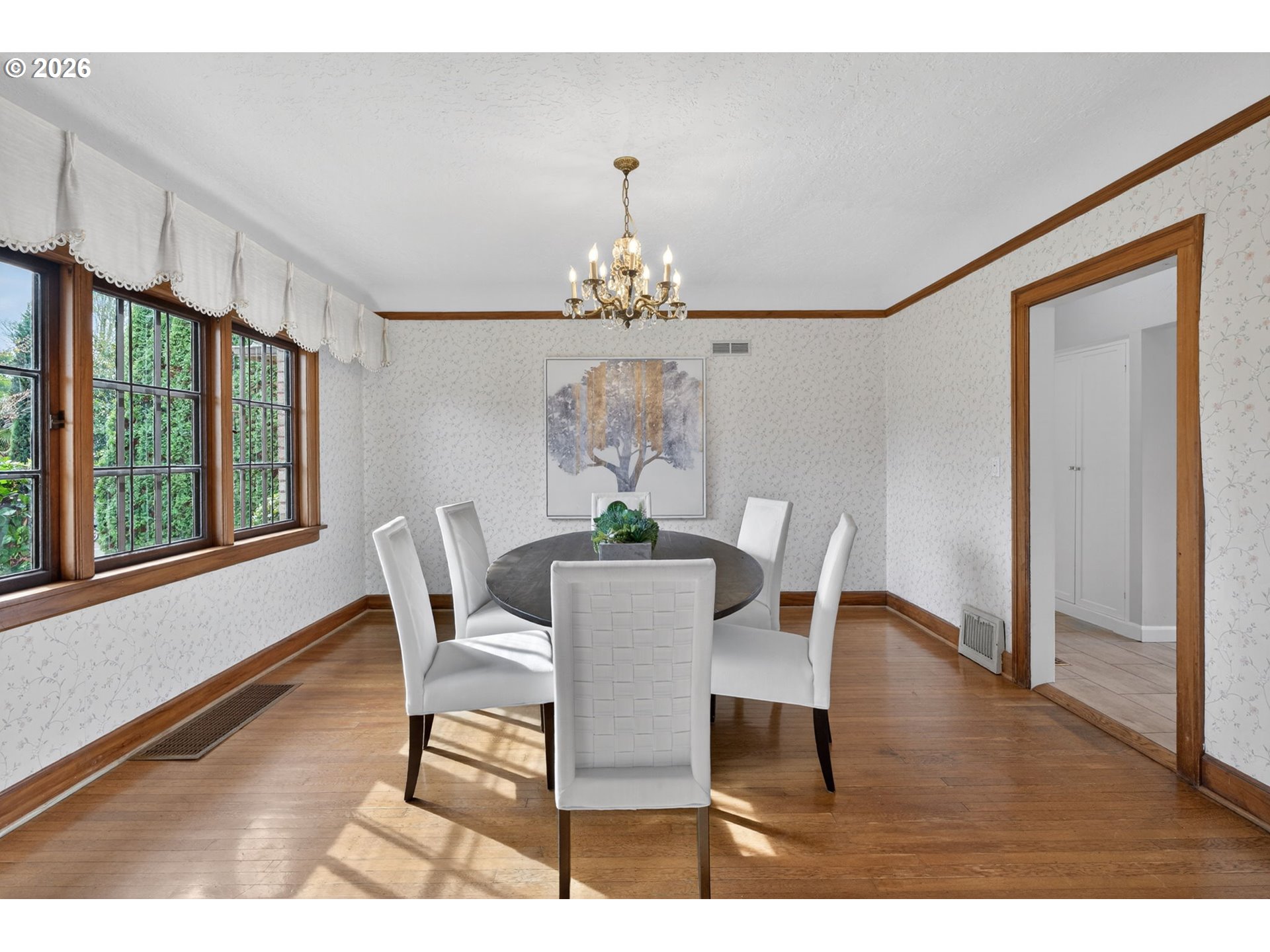 6971 North Vincent Avenue Portland, OR 97217 - Photo 15 of 48 a dining room with furniture a potted plant and a chandelier