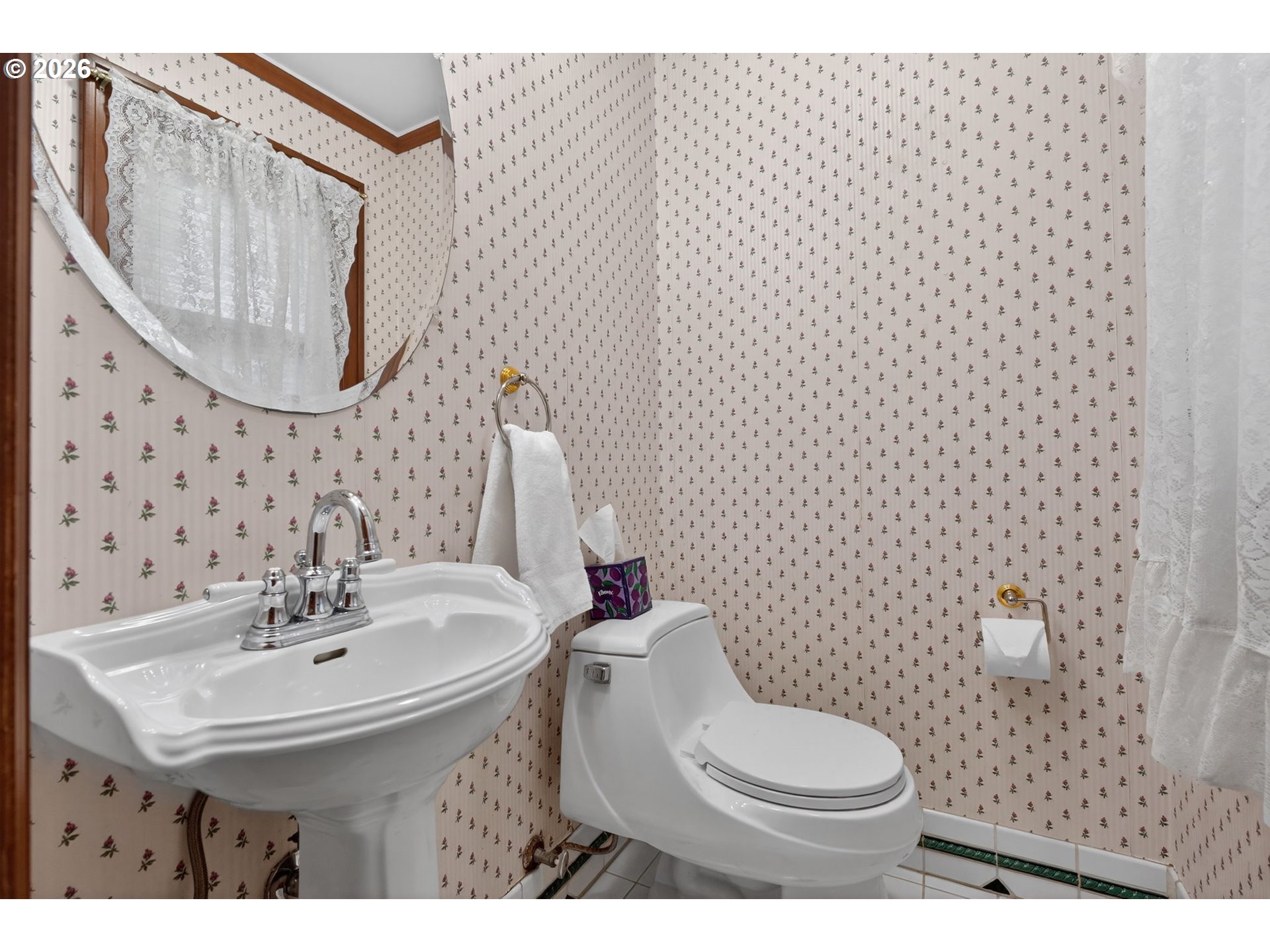 6971 North Vincent Avenue Portland, OR 97217 - Photo 22 of 48 a bathroom with a sink a toilet and mirror