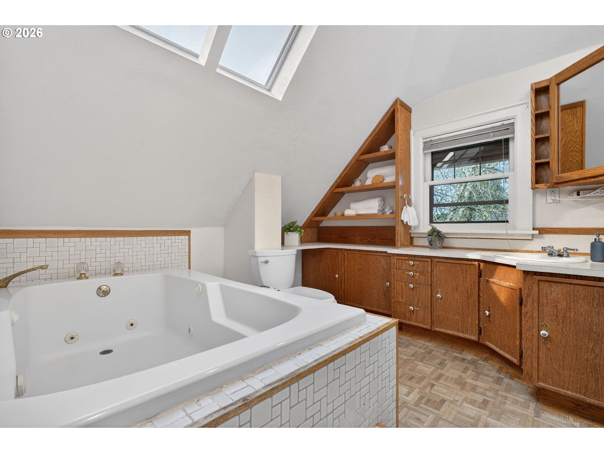 6971 North Vincent Avenue Portland, OR 97217 - Photo 28 of 48 a bathroom with a tub sink and mirror