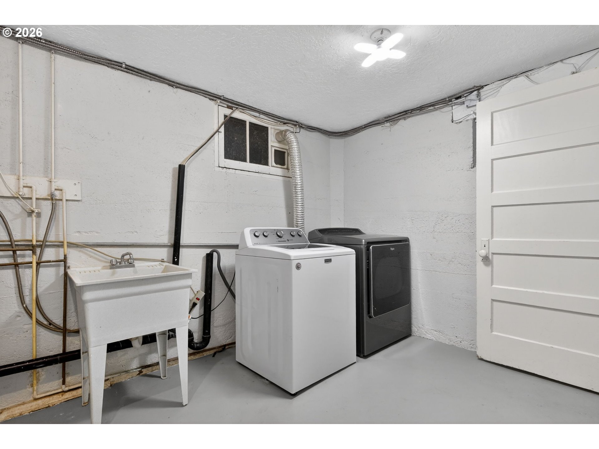 6971 North Vincent Avenue Portland, OR 97217 - Photo 35 of 48 a utility room with multiple dryer and washer