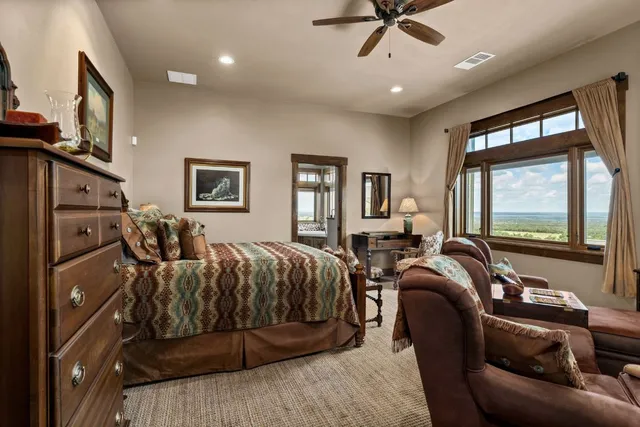 a bedroom with furniture and a window