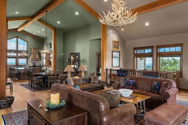 a living room with furniture a chandelier and a chandelier