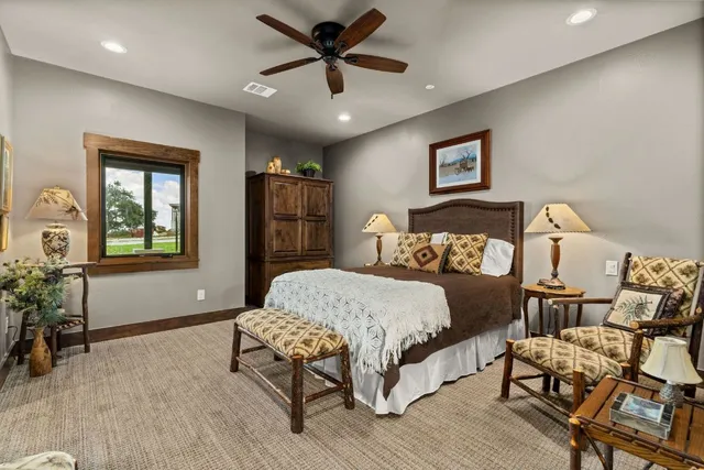 a bedroom with a bed and a potted plant