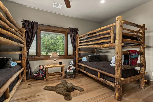 a bedroom with furniture and a window