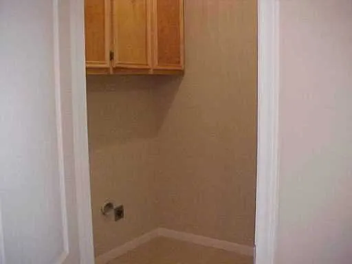 a front view of a building with glass top table and chairs