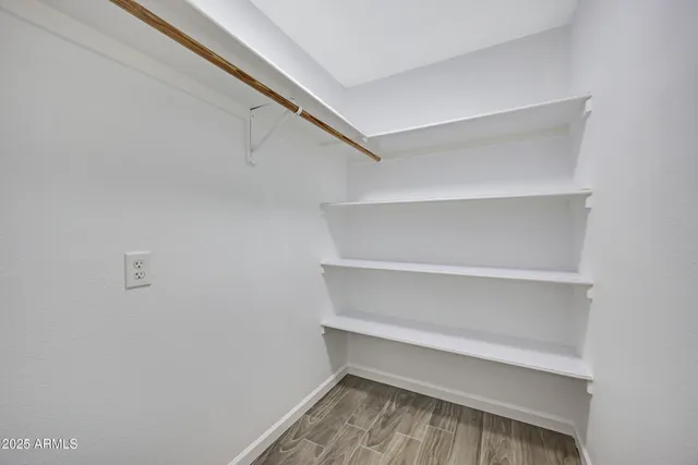 a view of a swimming pool with a lounge chairs