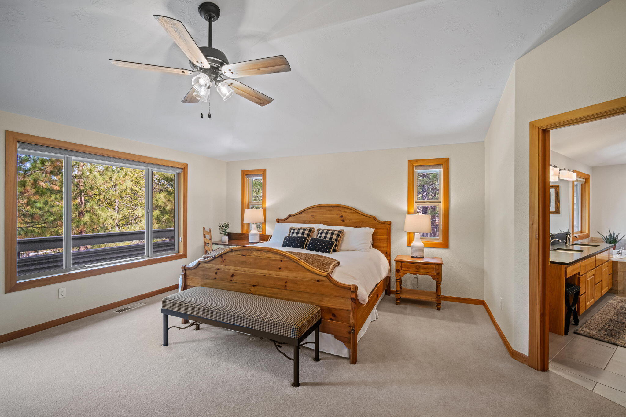 17948 Shadow Lane, Unit 7 Sunriver, OR 97707 - Photo 37 of 92 a bedroom with a bed and a chandelier