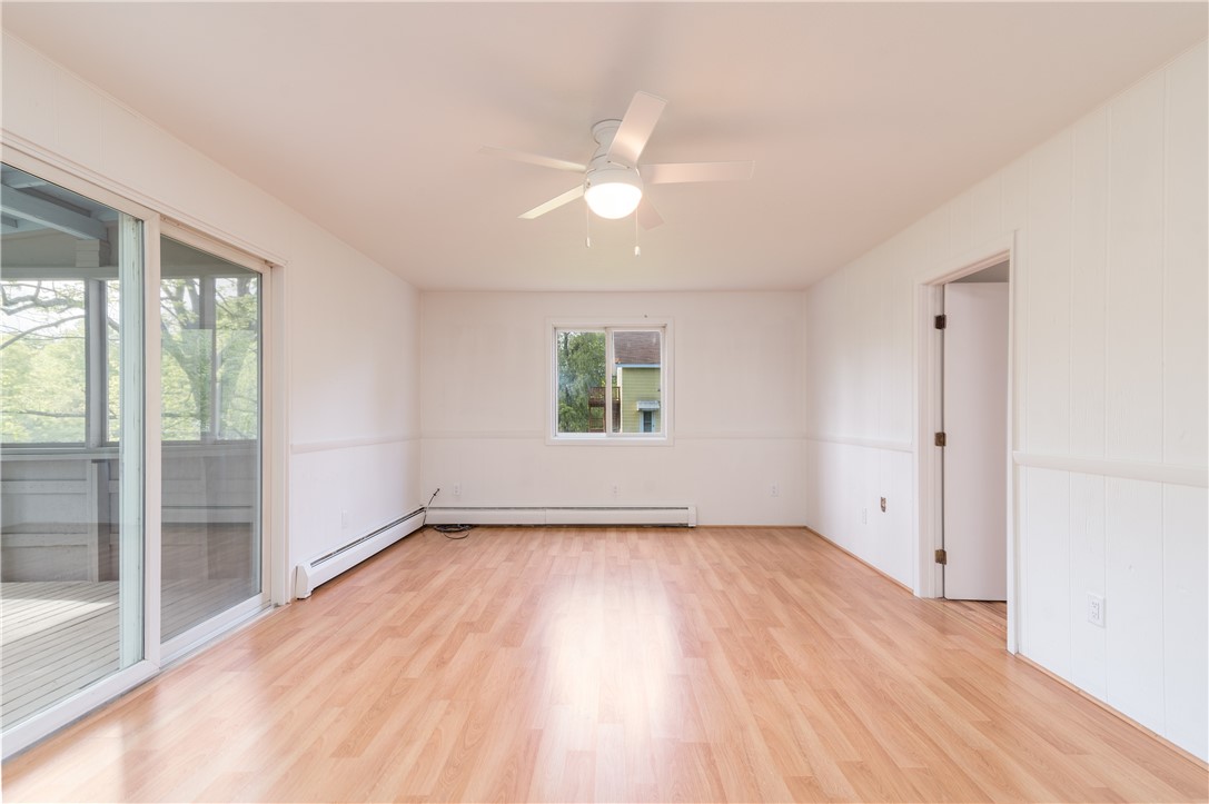 9 Christian Hill Road Westerly, RI 02891 - Photo 11 of 33 Family Room with slider to porch. Door to 1st floor Bedroom