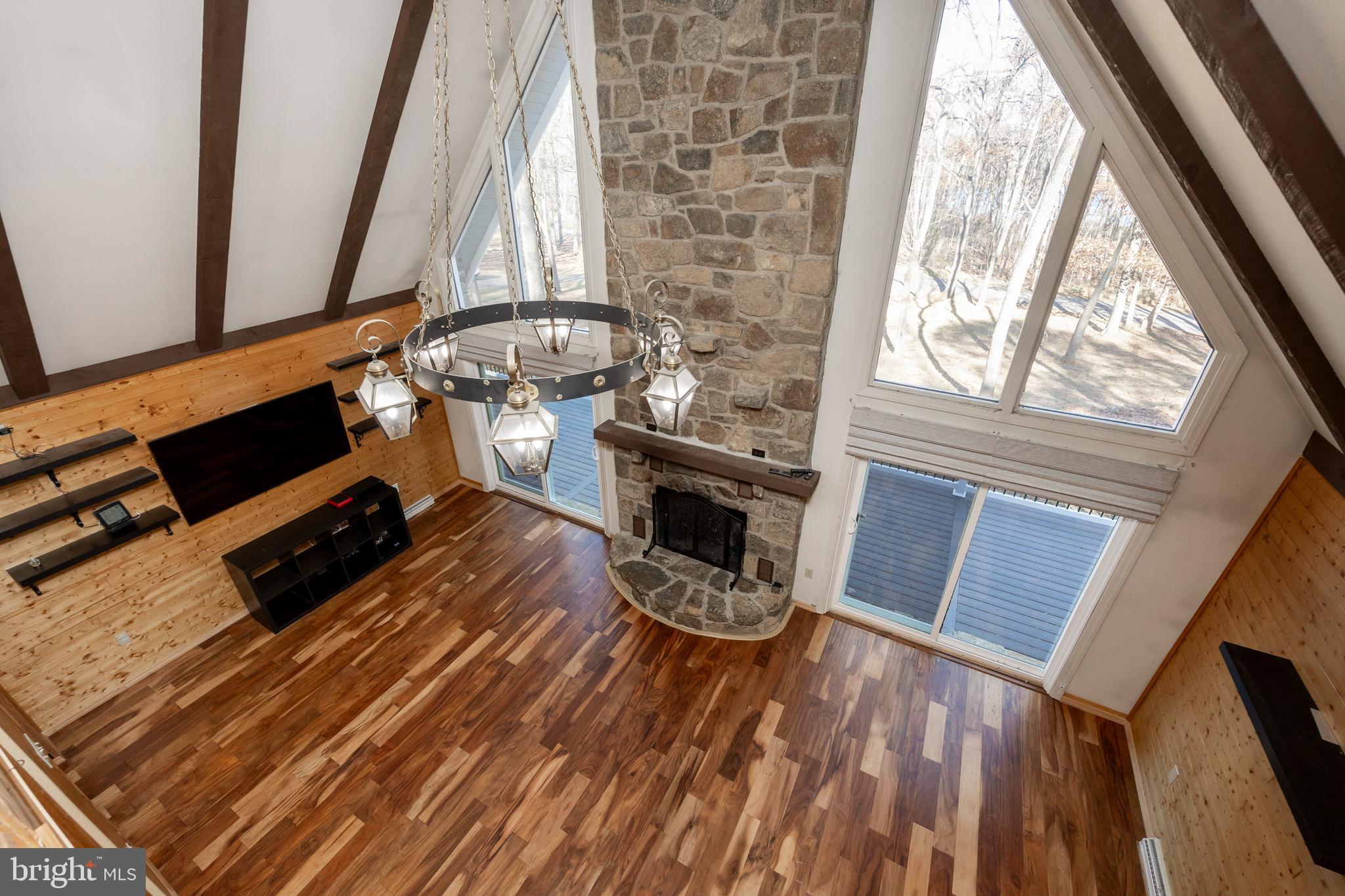 151 Bollinger Road Elverson, PA 19520 - Photo 7 of 37 Great Room with Floor-to-Ceiling Fireplace