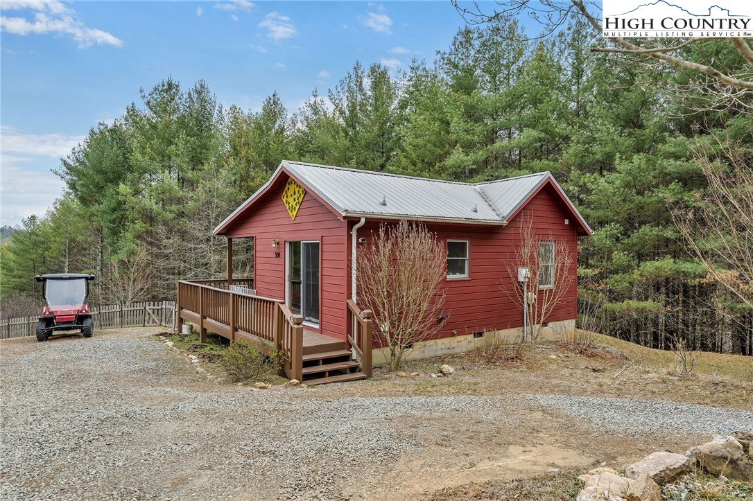 508 Curly Q Drive Crumpler, NC 28617 - Photo 39 of 39 a view of a house with a yard and sitting area