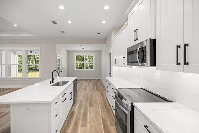 a kitchen with a stove and a microwave
