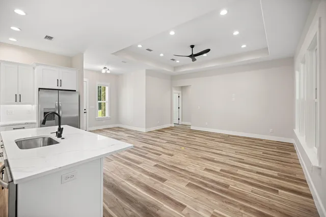 a kitchen with a sink stove and microwave