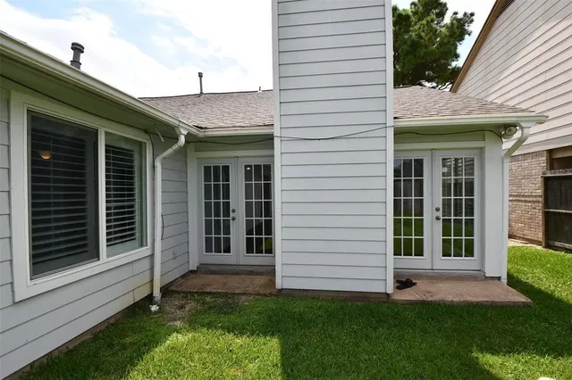 a view of a house with a yard and a garden