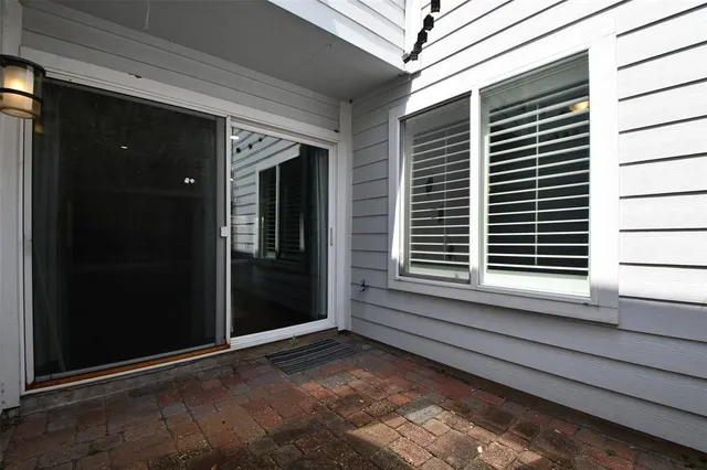 a view of a house with a large window and stairs