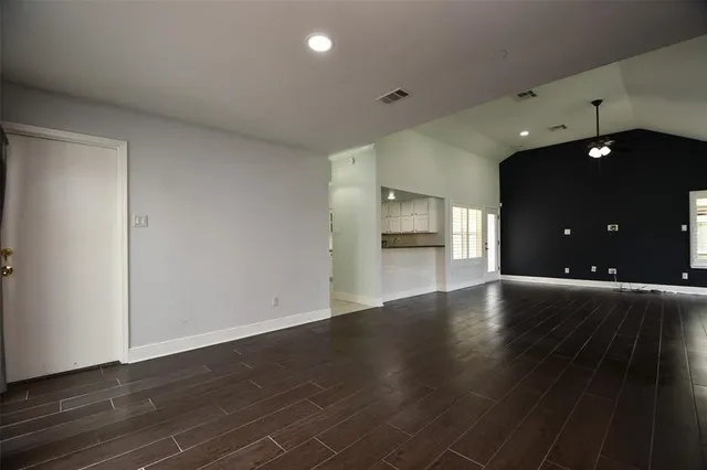 a view of a kitchen with a sink and a stove top oven