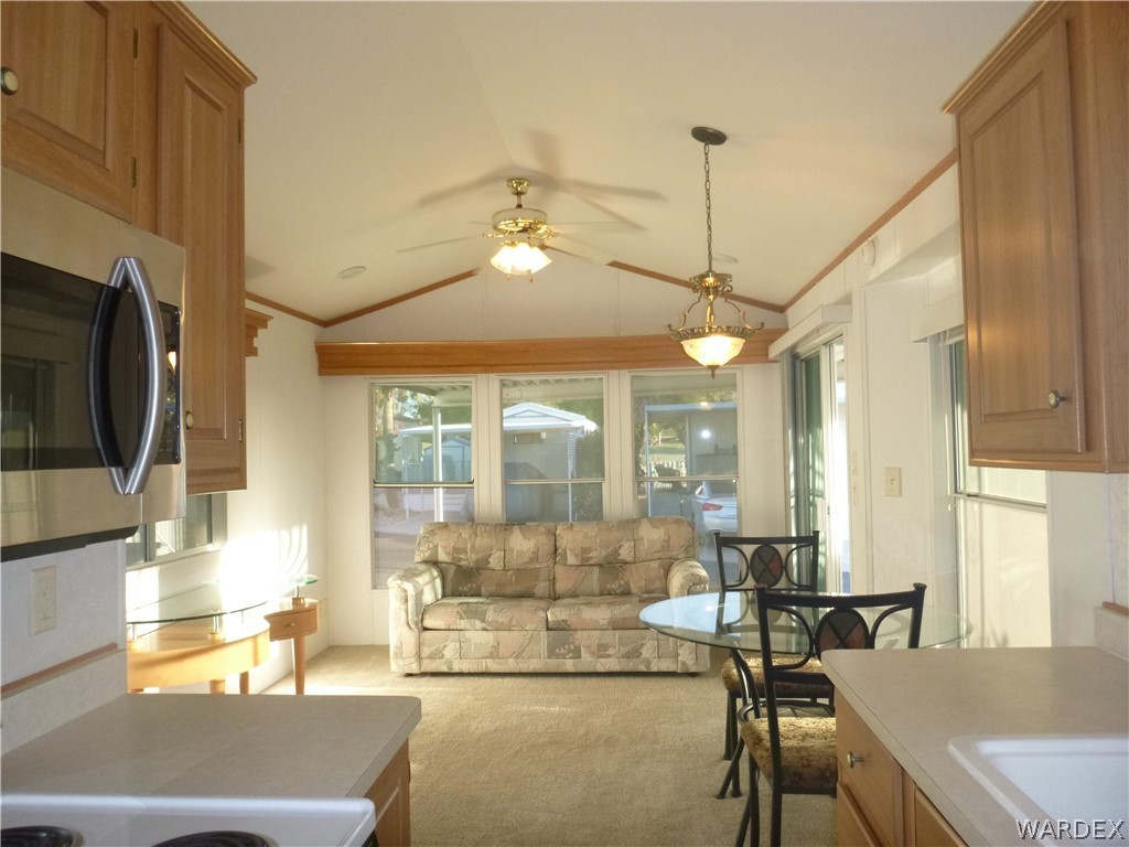 2000 South Ramar Road, Unit 688 Bullhead City, AZ 86442 - Photo 14 of 20 a living room with fireplace furniture and a flat screen tv