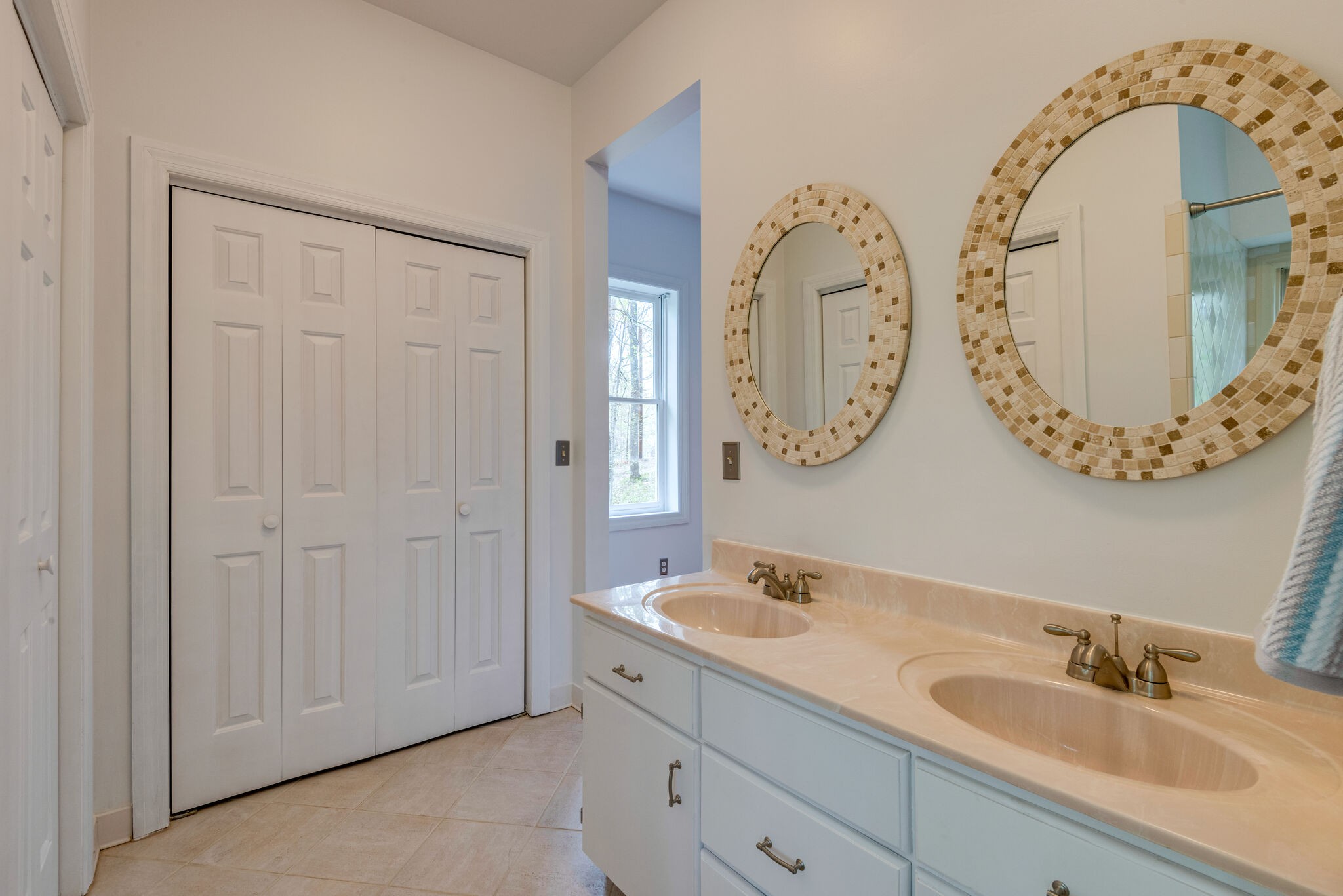 215 Brown Owl Road Fairview, TN 37062 - Photo 14 of 25 a bathroom with a double vanity sink and a mirror
