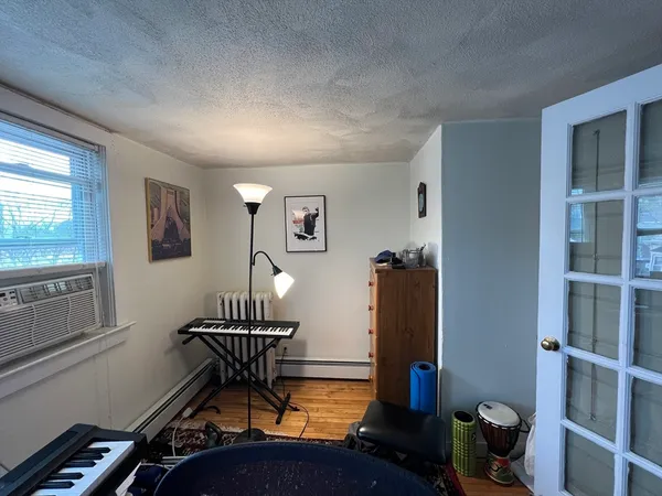 a room with furniture and wooden floor