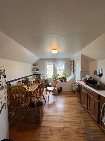 a room with furniture and a view of living room