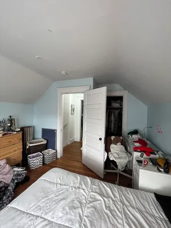a bedroom with a bed and furniture