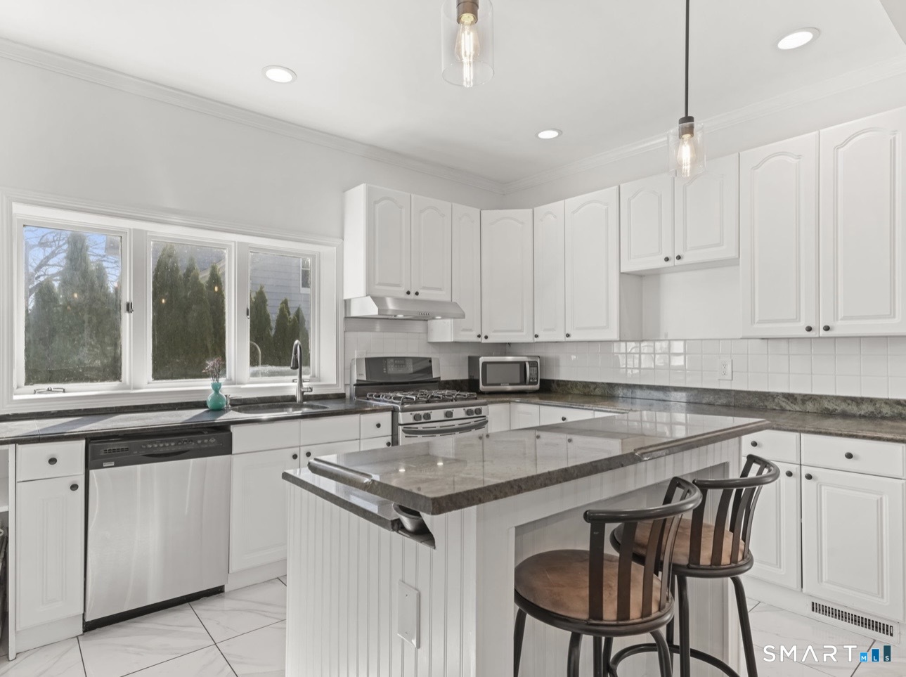 709 Tunxis Hill Road Fairfield, CT 06825 - Photo 2 of 31 Spacious eat-in kitchen, fully loaded with updated appliances and plenty of natural light.