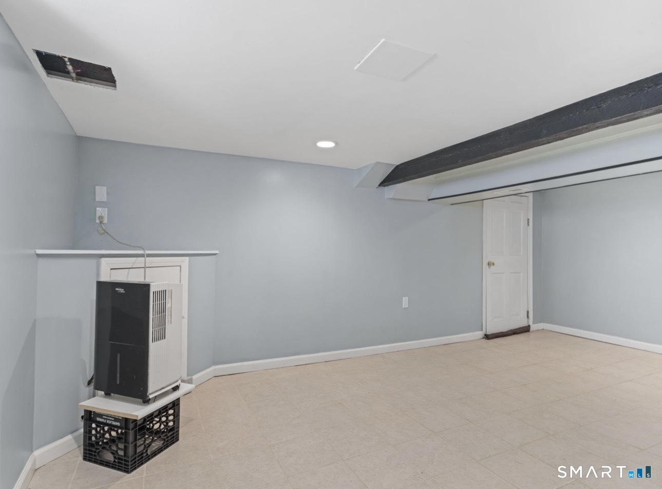 709 Tunxis Hill Road Fairfield, CT 06825 - Photo 23 of 31 Partially finished; gym, game/playroom, storage