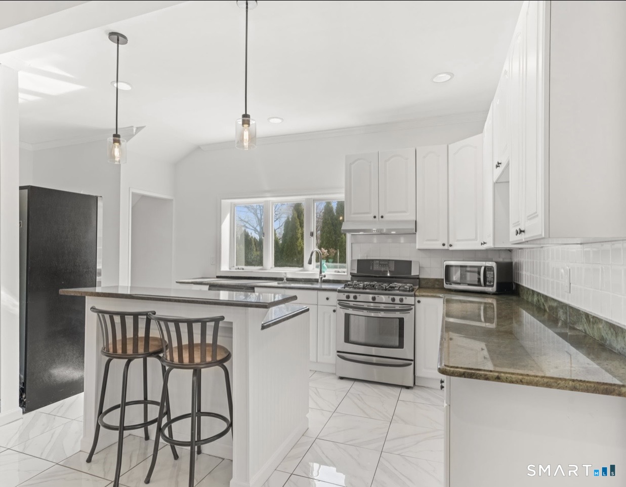709 Tunxis Hill Road Fairfield, CT 06825 - Photo 4 of 31 Spacious eat-in kitchen, fully loaded with updated appliances and plenty of natural light.