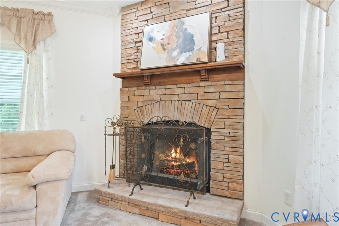 28231 Lewis Moore Road Ruther Glen, VA 22546 - Photo 15 of 50 a living room with furniture a fireplace and a window