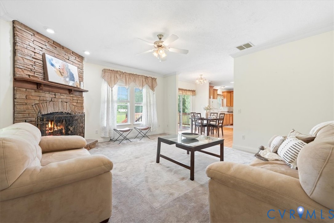 28231 Lewis Moore Road Ruther Glen, VA 22546 - Photo 16 of 50 a living room with furniture and a fireplace